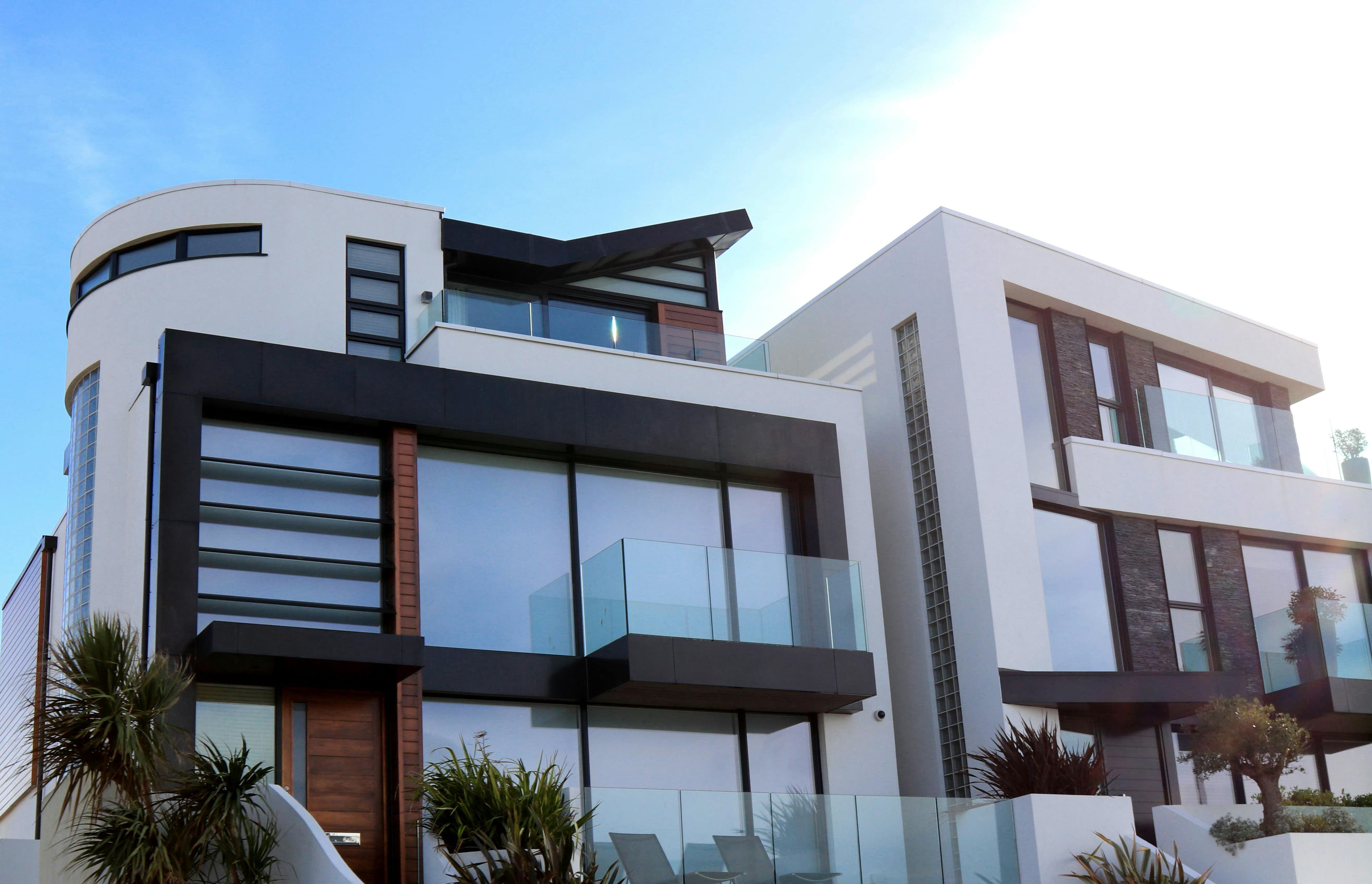 Modern luxury home with curved architecture and floor-to-ceiling glass